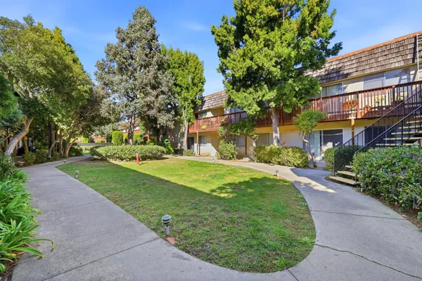 a view of a garden with an outdoor seating