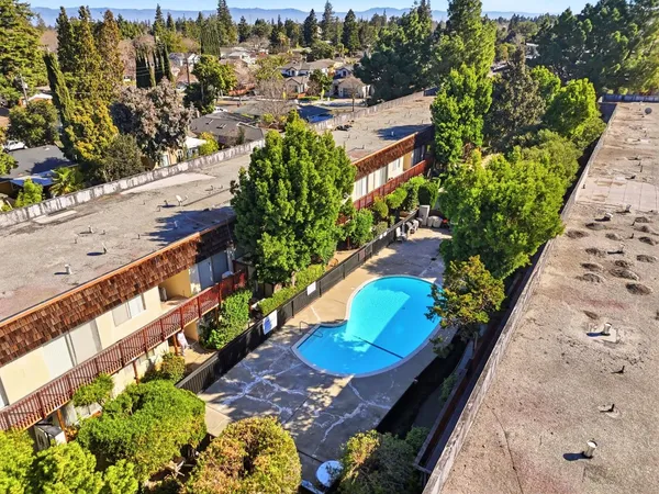 a view of a balcony with wooden floor