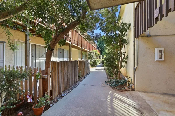a swimming pool with outdoor seating and yard