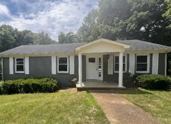 front view of a house with a yard