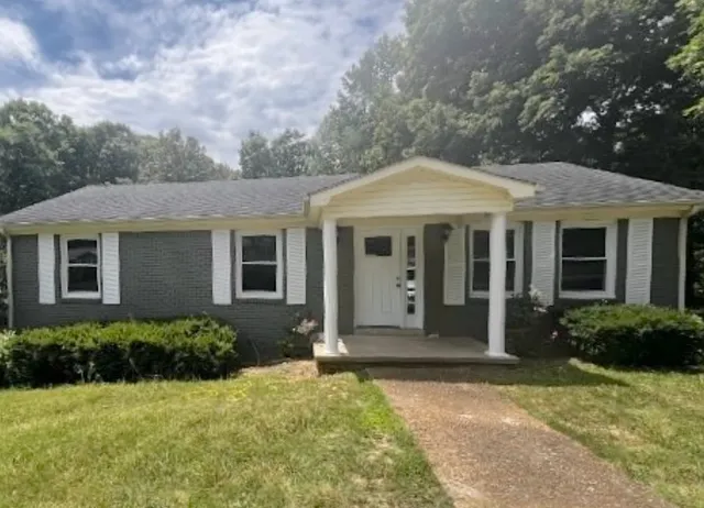 front view of a house with a yard