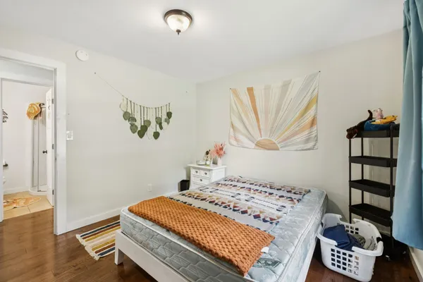 a bedroom with a bed and a book shelf