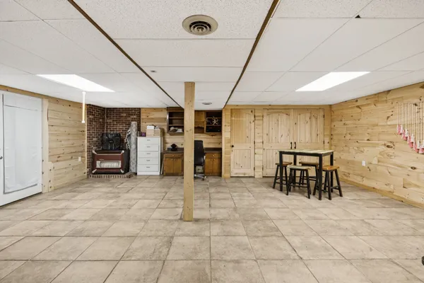 a view of a hallway with seating area