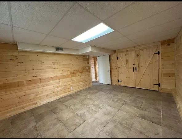 a bathroom with a sink mirror and vanity