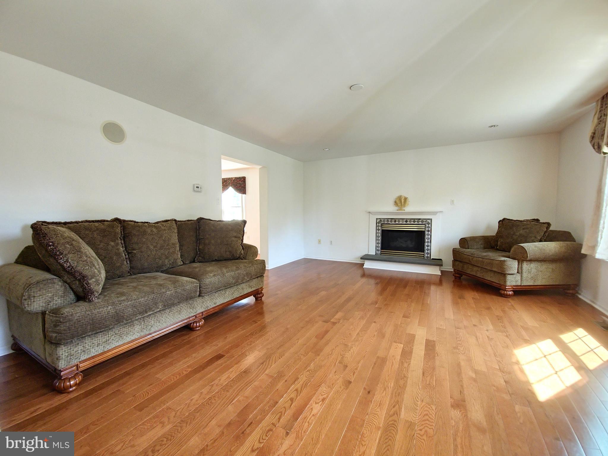 1119 Secane Road Secane, PA 19018 - Photo 3 of 15 a living room with furniture and a fireplace