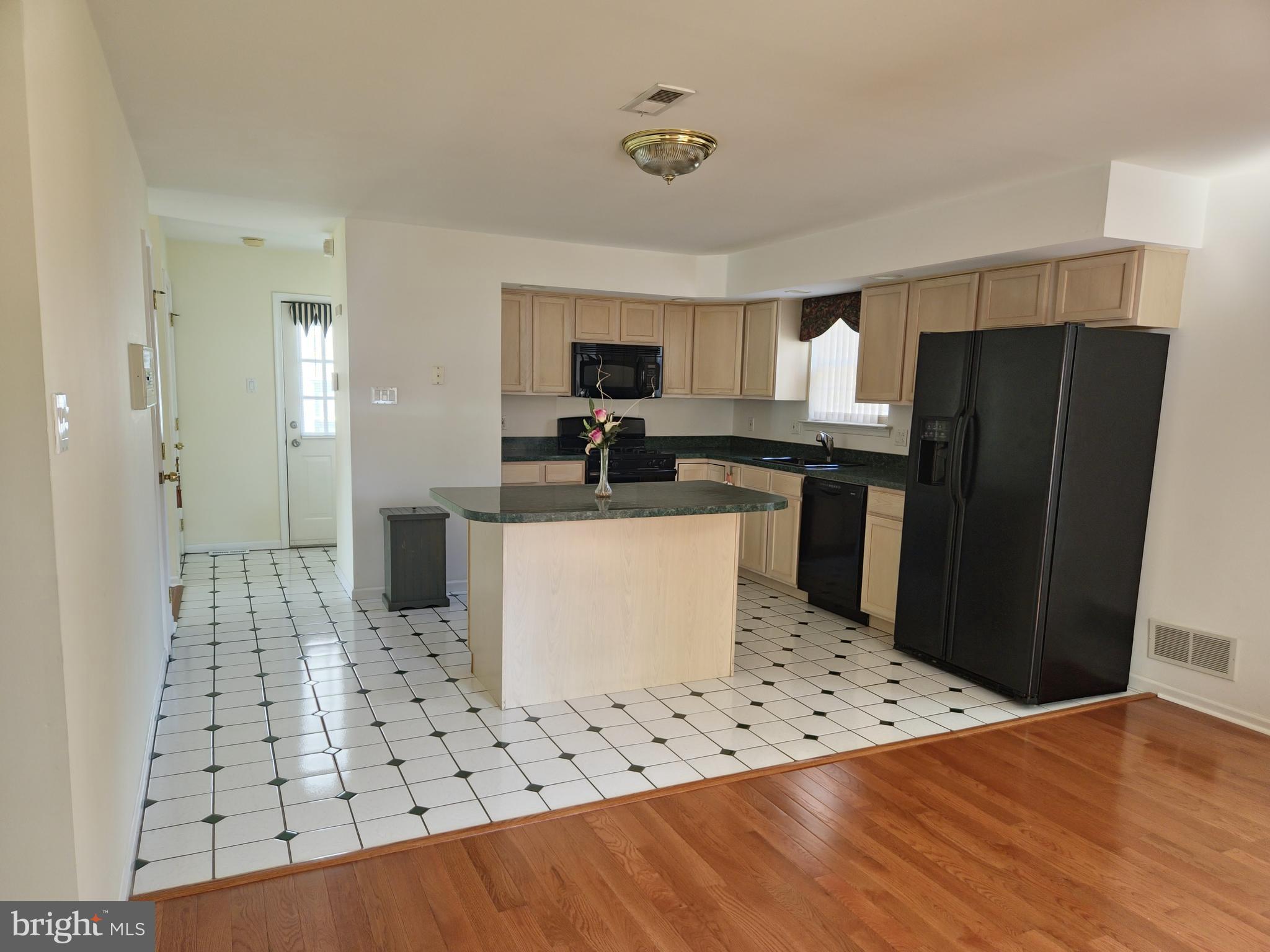 1119 Secane Road Secane, PA 19018 - Photo 4 of 15 a kitchen with stainless steel appliances a refrigerator sink and microwave