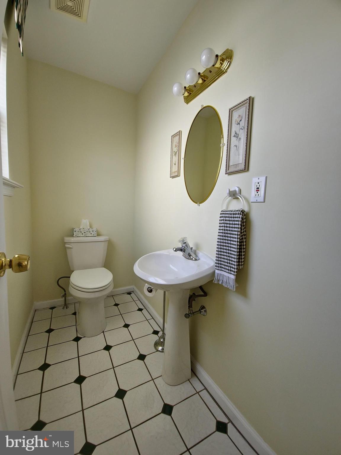 1119 Secane Road Secane, PA 19018 - Photo 6 of 15 a bathroom with a toilet and a mirror