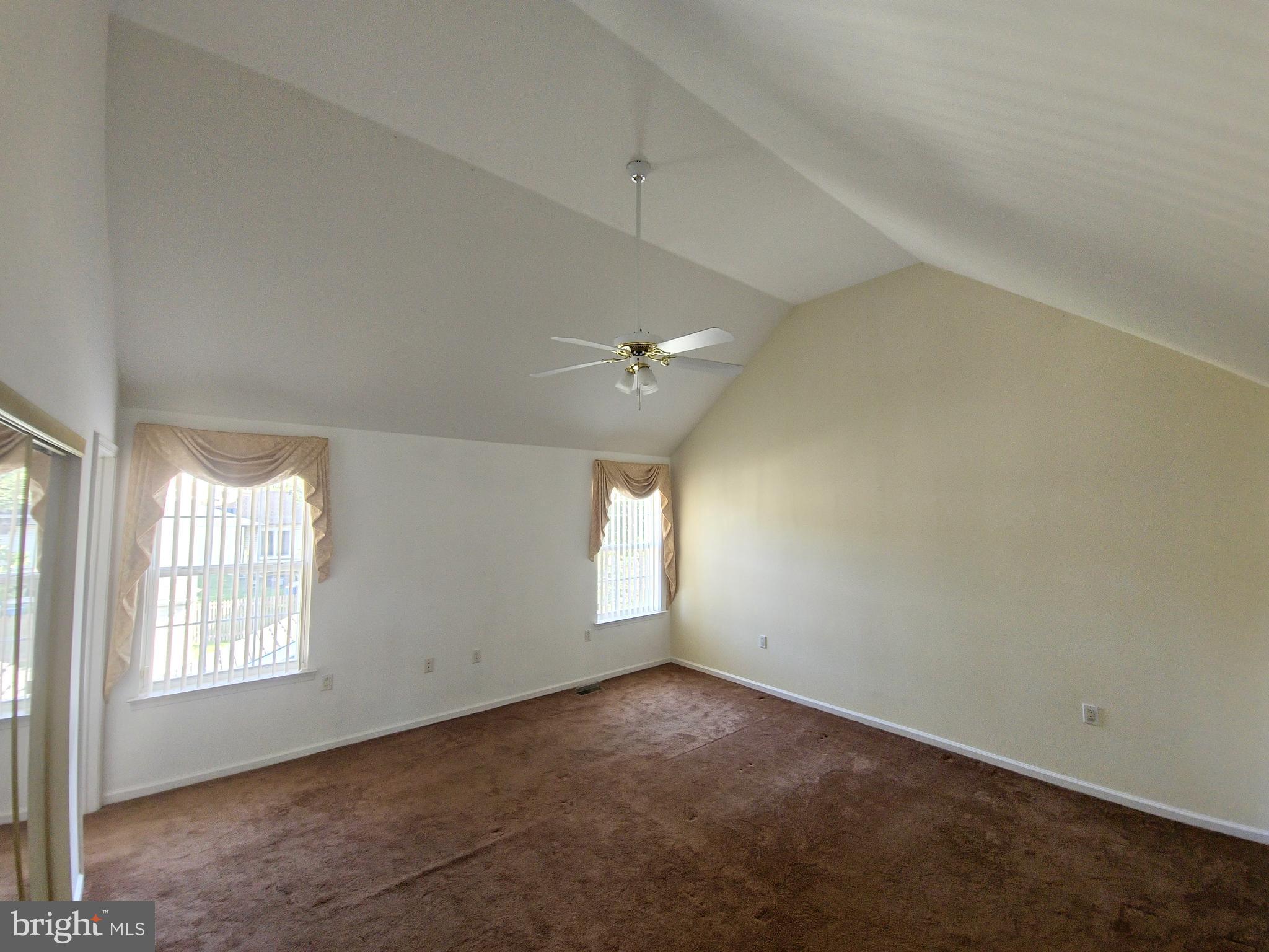 1119 Secane Road Secane, PA 19018 - Photo 7 of 15 an empty room with windows and ceiling fan