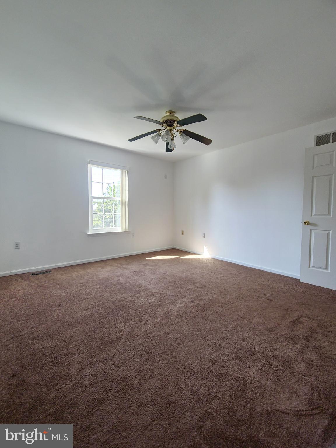 1119 Secane Road Secane, PA 19018 - Photo 9 of 15 an empty room with a ceiling fan and window
