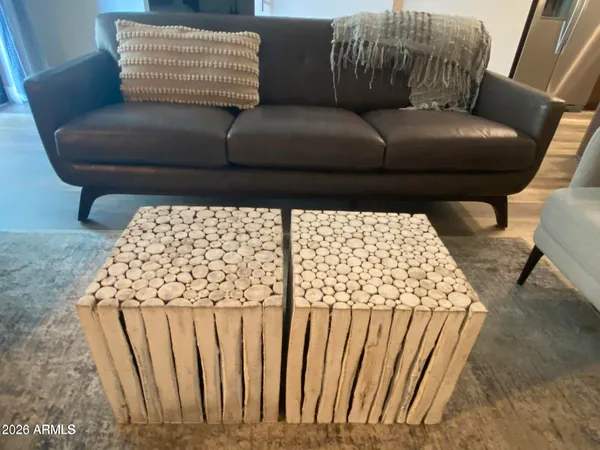 a living room with furniture and a mirror