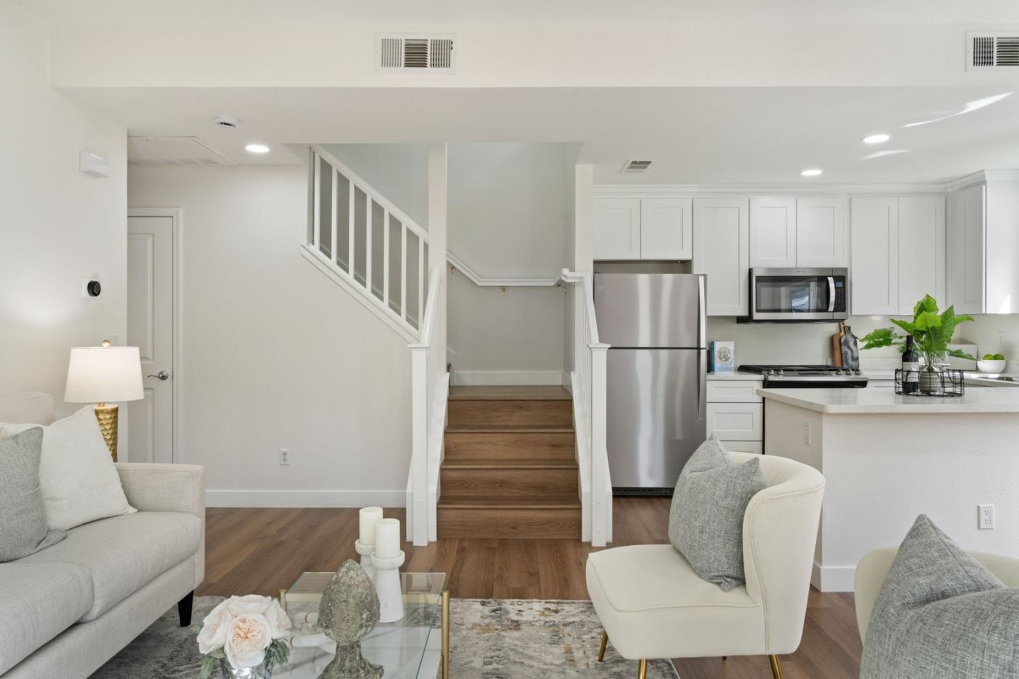 729 Cottage Court Mountain View, CA 94043 - Photo 22 of 41 a living room with furniture a couch and a refrigerator