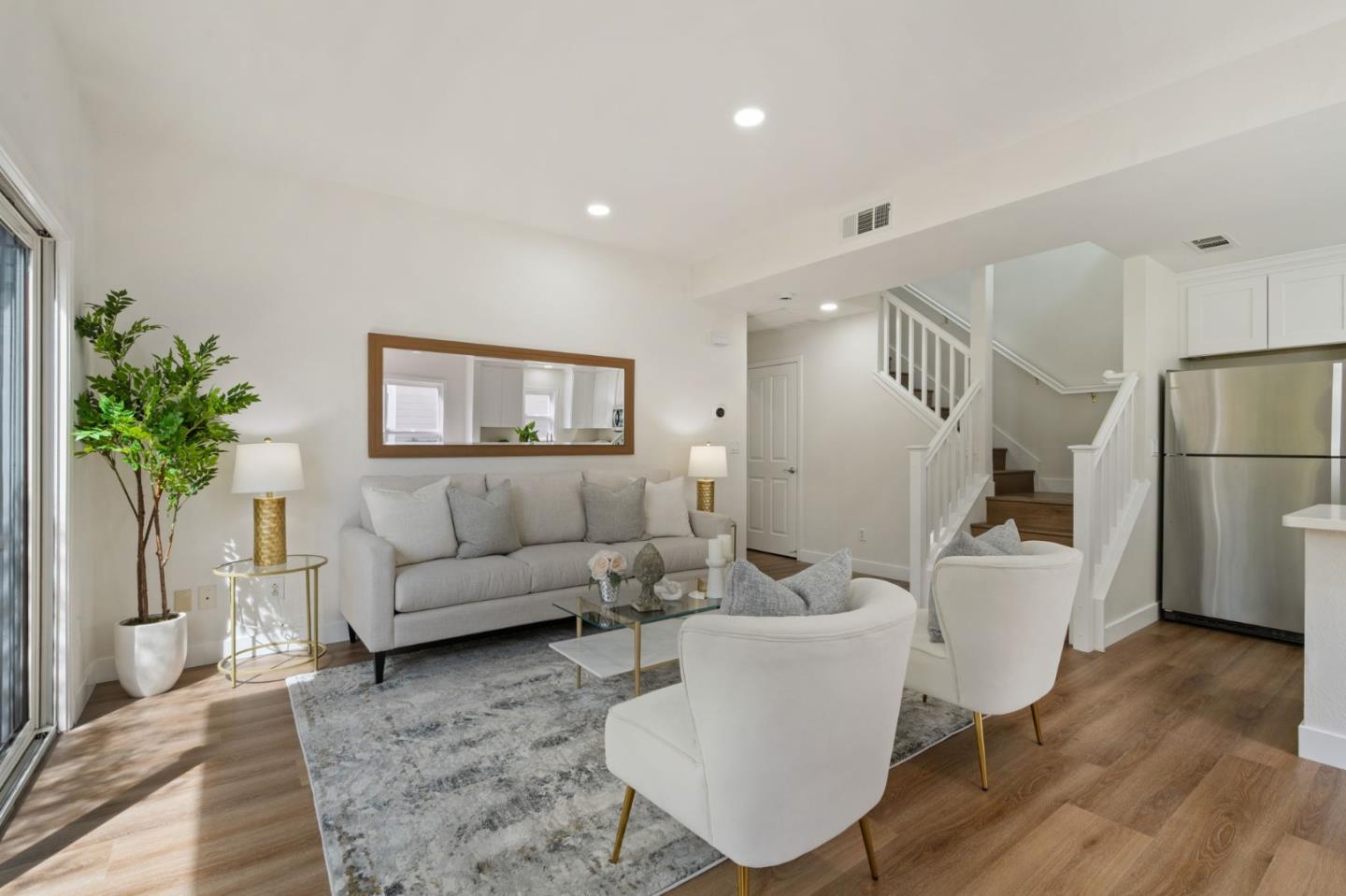 729 Cottage Court Mountain View, CA 94043 - Photo 5 of 41 a living room with furniture a wooden floor a glass door and a couch