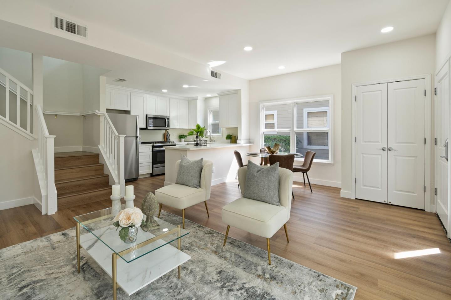 729 Cottage Court Mountain View, CA 94043 - Photo 6 of 41 a living room with furniture a rug and kitchen view