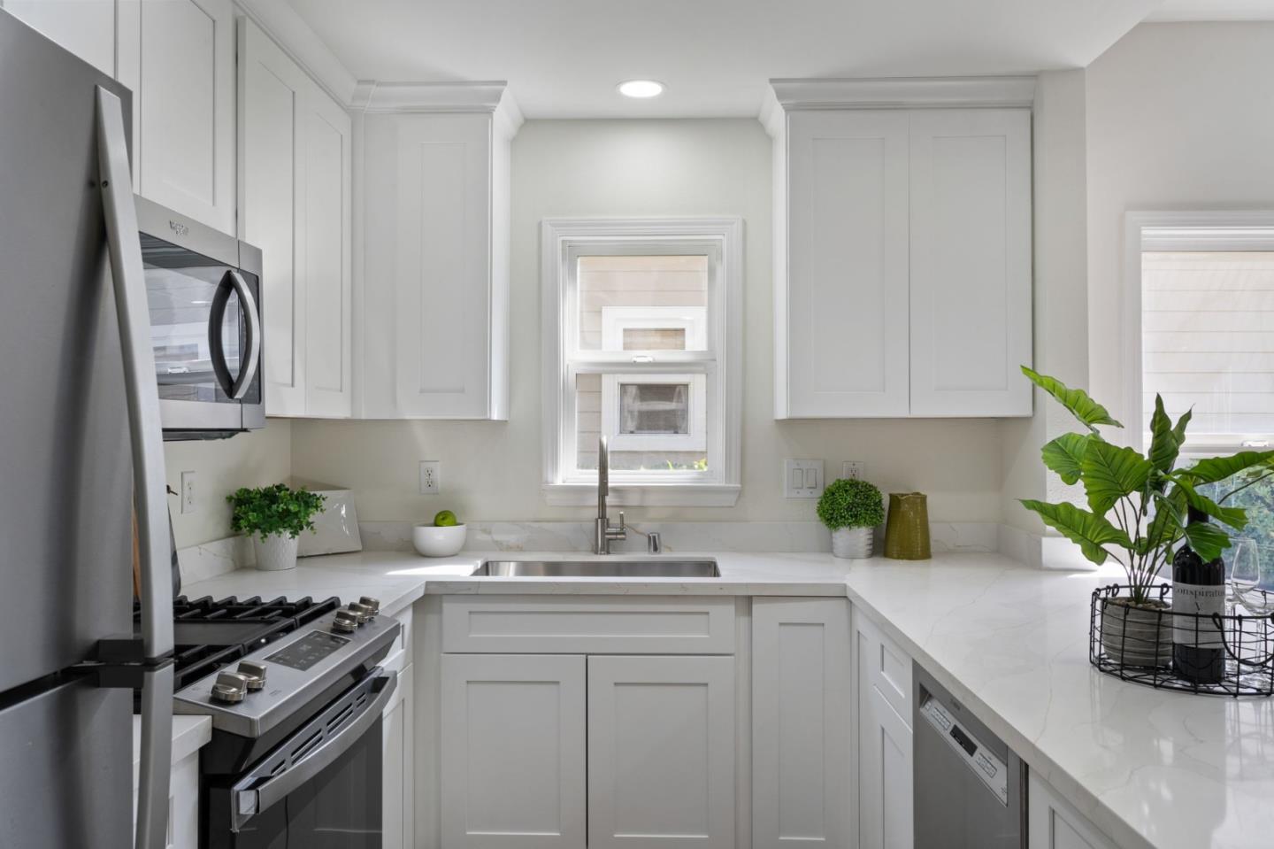 729 Cottage Court Mountain View, CA 94043 - Photo 7 of 41 a kitchen with stainless steel appliances granite countertop a sink a stove and a white cabinets