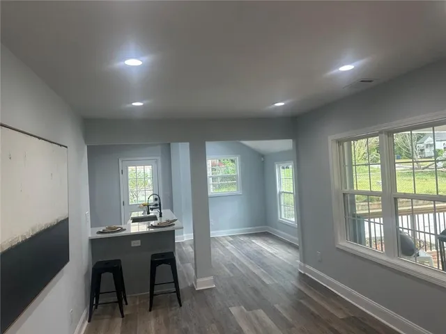 a living room with furniture and a table