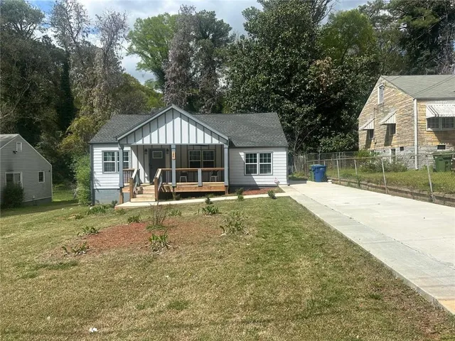 a house with trees in the background