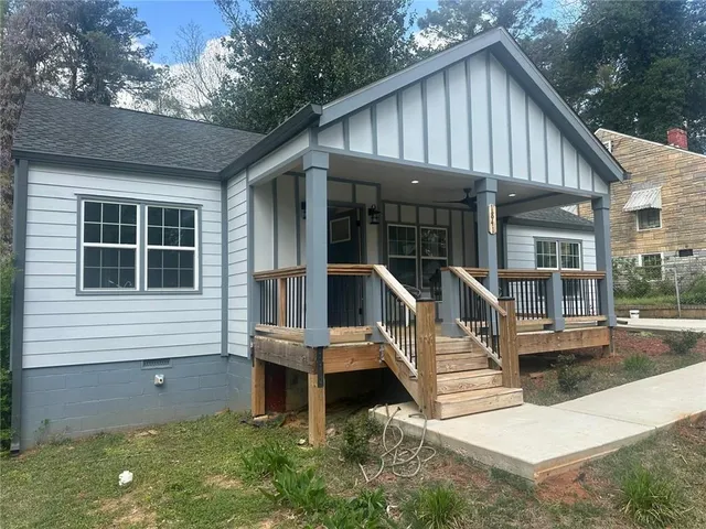 a view of house with swimming pool and porch with furniture
