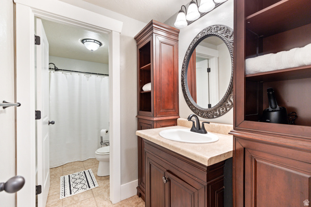 580 Cherry Ridge Lane Richmond, UT 84333 - Photo 44 of 53 Bathroom featuring vanity, a shower with curtain, and light tile patterned floors