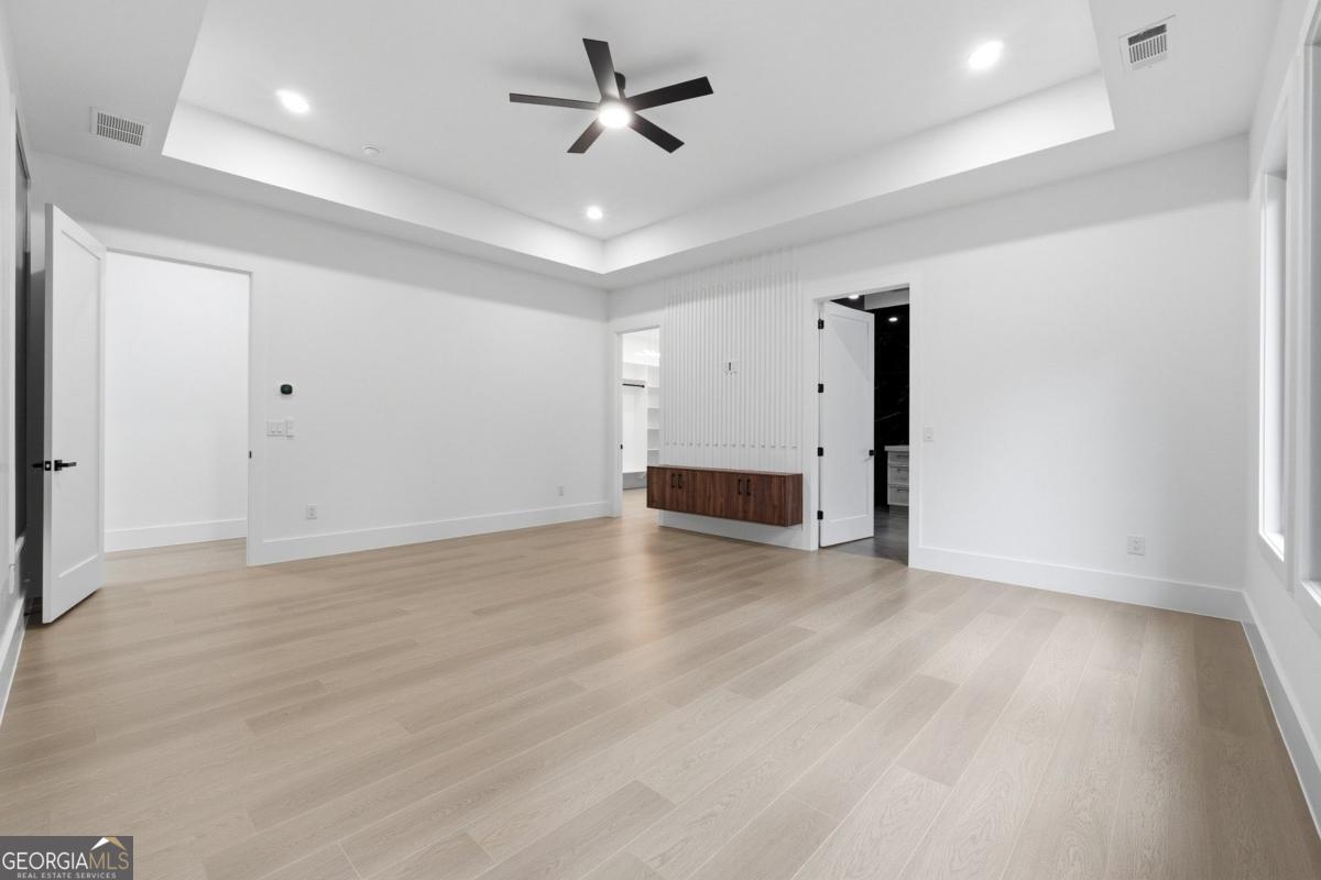 1563 Whitley Road Bethlehem, GA 30620 - Photo 17 of 44 a view of empty room with wooden floor and ceiling fan