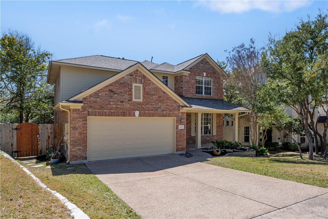 2845 Grimes Ranch Road Austin, TX 78732 - Photo 1 of 1 a front view of a house with a yard and garage