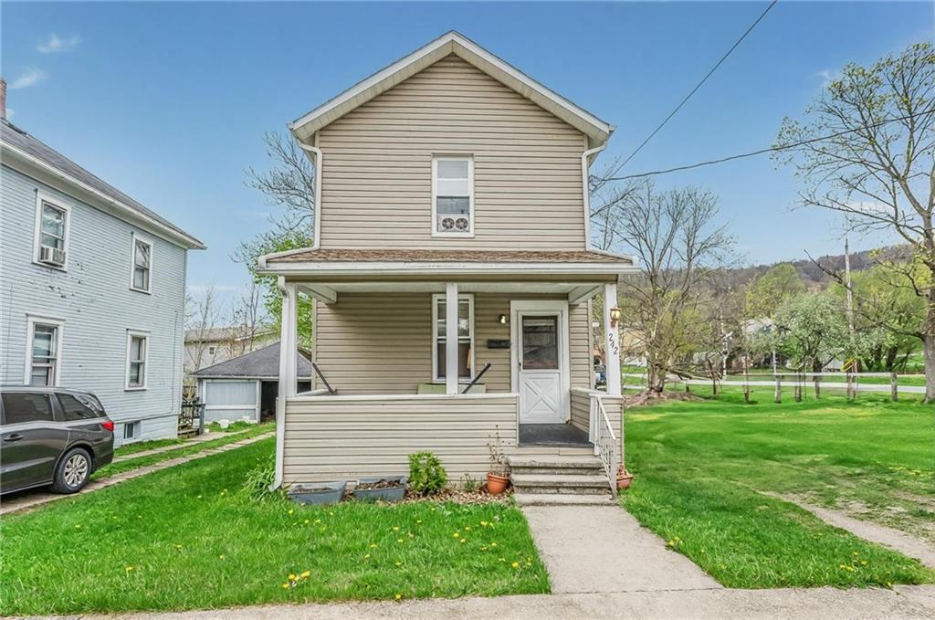 242 North 10th Street Indiana, PA 15701 - Photo 1 of 18 a front view of a house with a yard