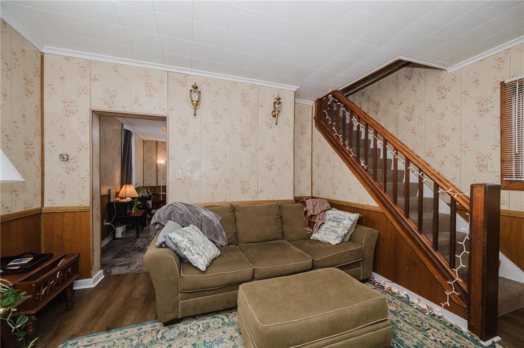 242 North 10th Street Indiana, PA 15701 - Photo 11 of 18 a living room with furniture and stairs
