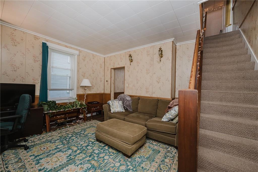 242 North 10th Street Indiana, PA 15701 - Photo 12 of 18 a living room with furniture and a fireplace