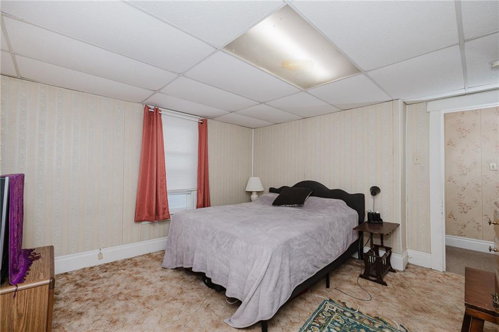 242 North 10th Street Indiana, PA 15701 - Photo 16 of 18 a bedroom with a bed and a flat screen tv
