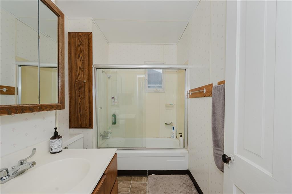 242 North 10th Street Indiana, PA 15701 - Photo 17 of 18 a bathroom with a bathtub and a sink