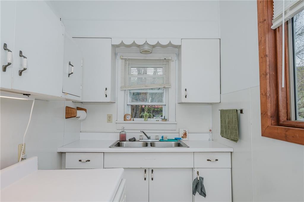 242 North 10th Street Indiana, PA 15701 - Photo 4 of 18 a kitchen with cabinets and window
