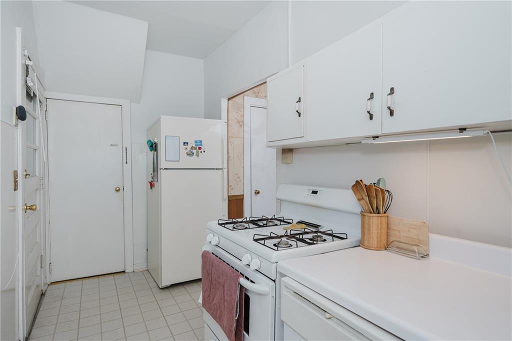 242 North 10th Street Indiana, PA 15701 - Photo 5 of 18 a kitchen with a refrigerator stove and sink