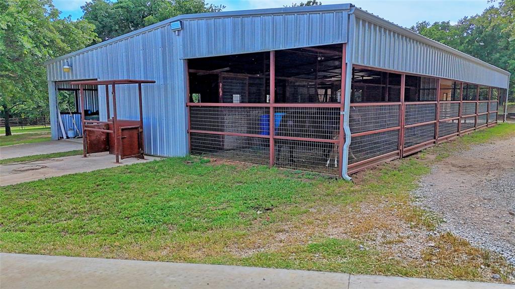 4509 Lazy E Road St. Jo, TX 76265 - Photo 12 of 39 a view of a house and a backyard