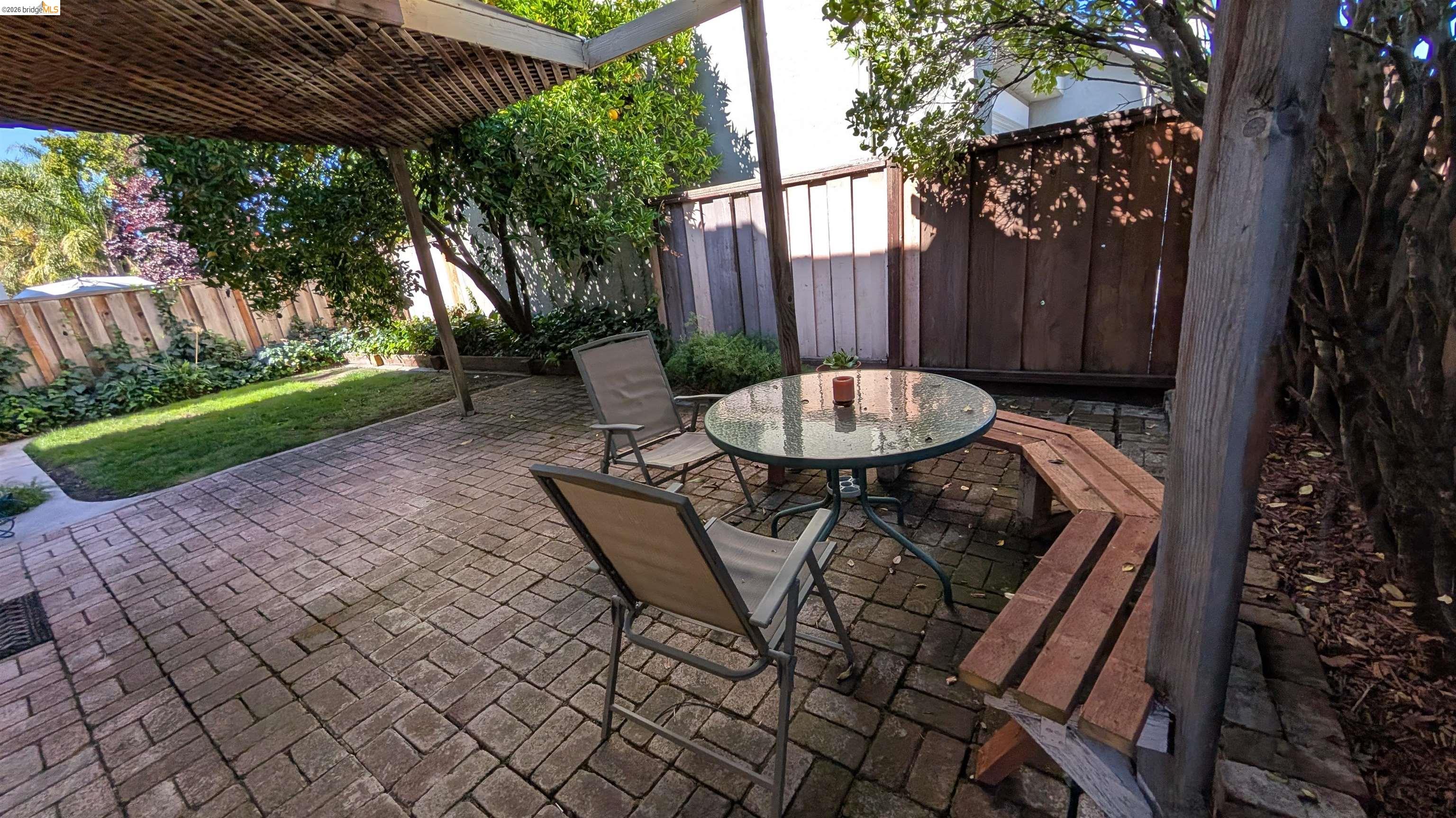 10013 Foxboro Circle San Ramon, CA 94583 - Photo 13 of 45 a view of a table and chairs in back yard of a house