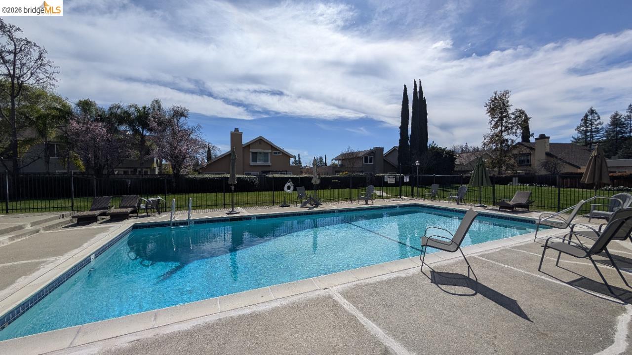 10013 Foxboro Circle San Ramon, CA 94583 - Photo 16 of 45 a view of swimming pool with outdoor seating and yard in the back