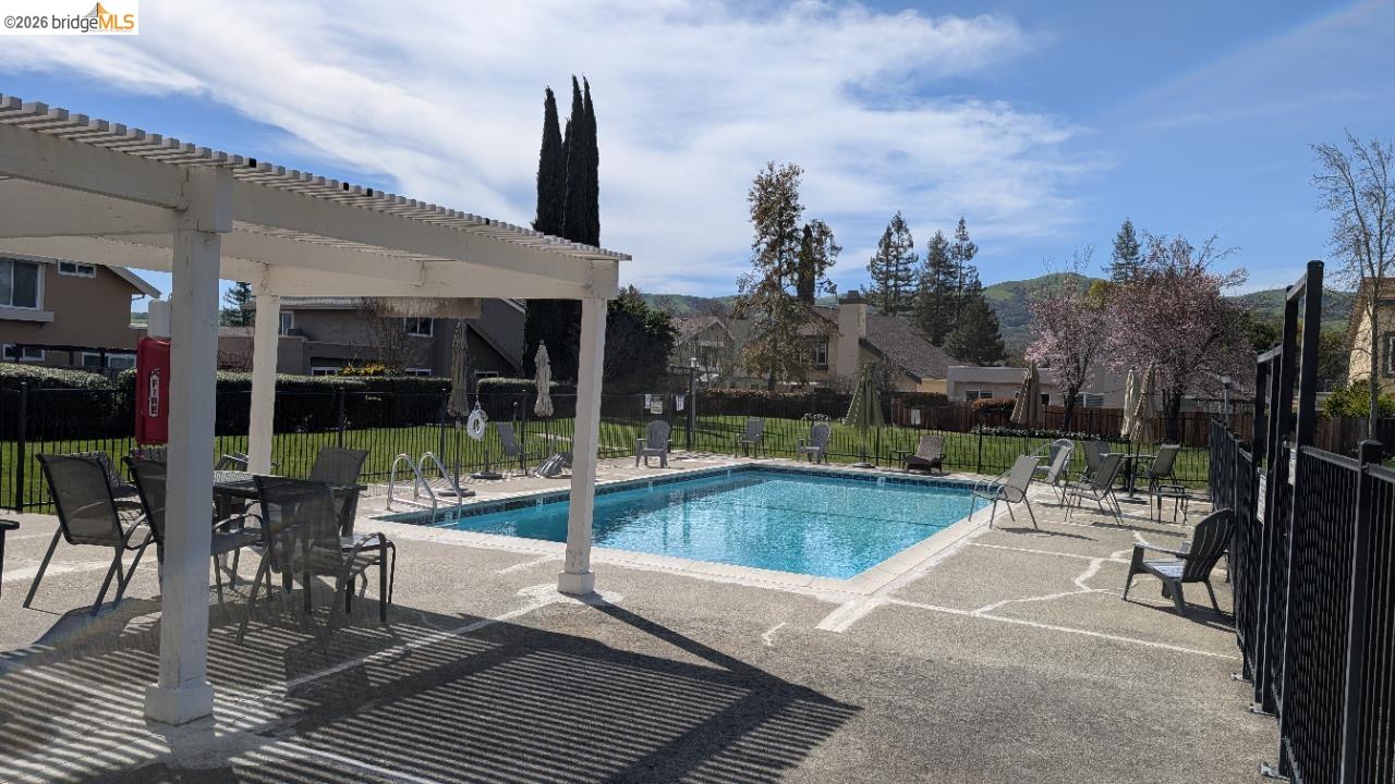 10013 Foxboro Circle San Ramon, CA 94583 - Photo 19 of 45 a view of a patio with a table chairs and a patio