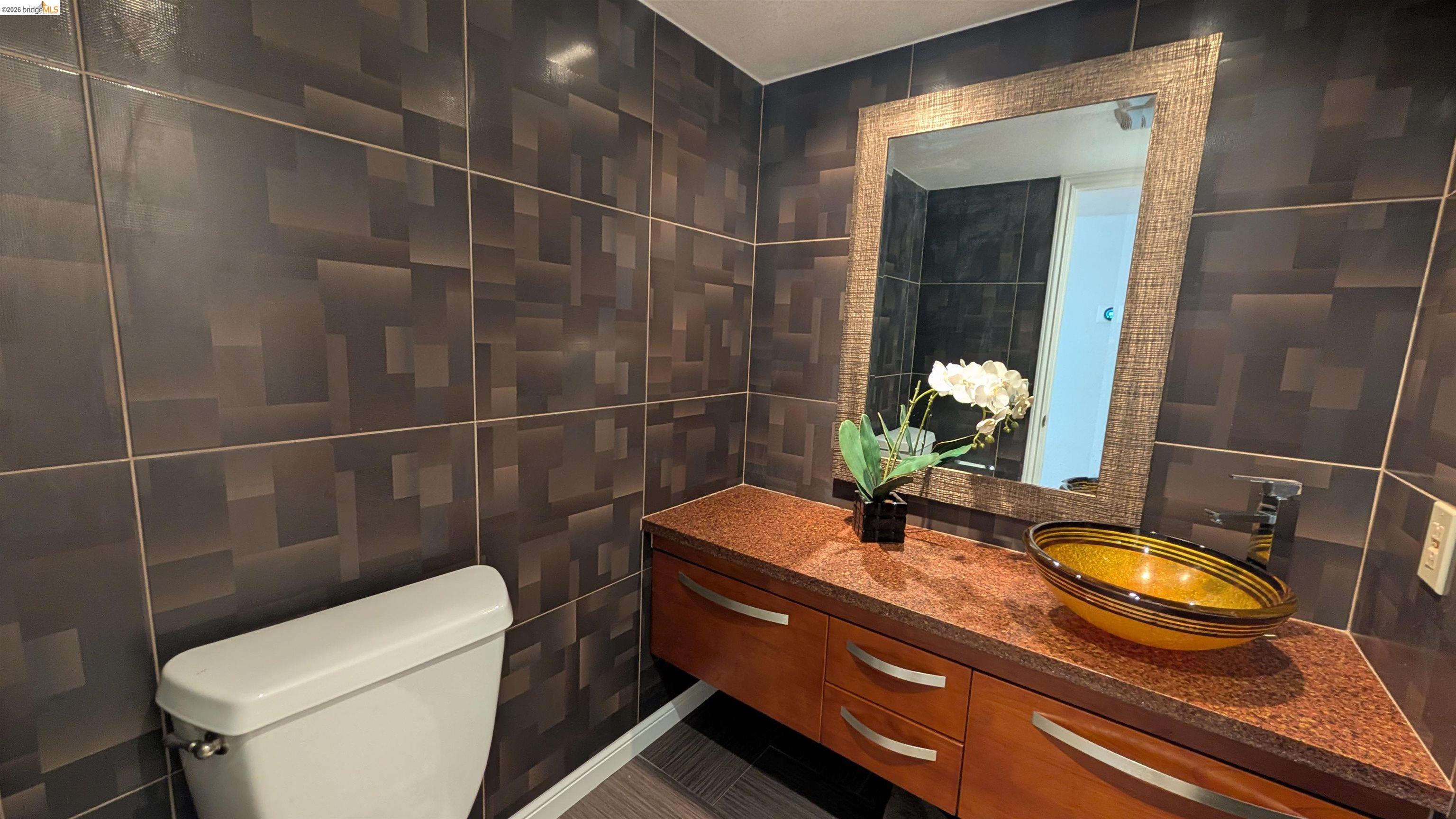 10013 Foxboro Circle San Ramon, CA 94583 - Photo 21 of 45 a bathroom with a sink a toilet and shower