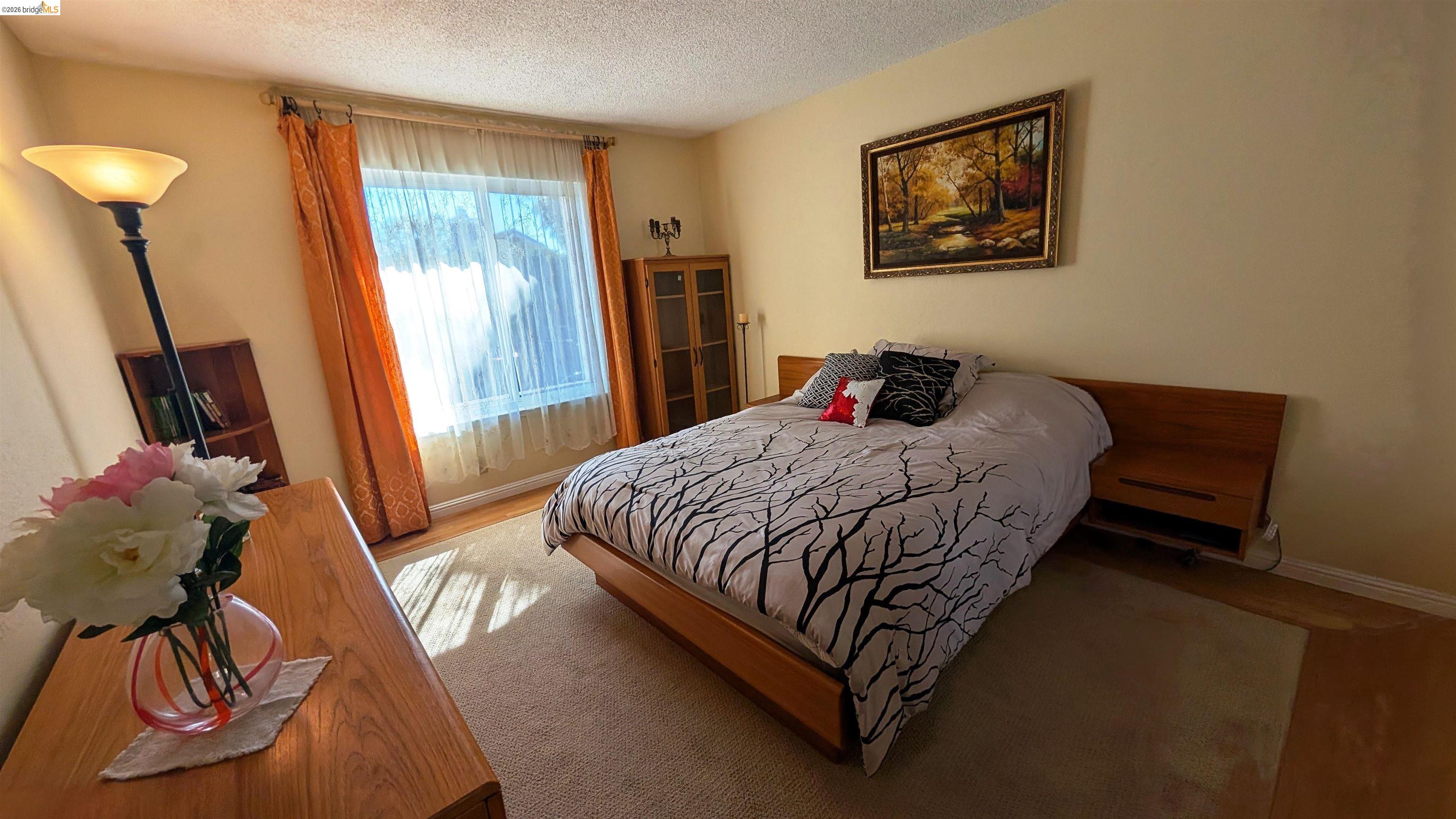 10013 Foxboro Circle San Ramon, CA 94583 - Photo 23 of 45 a bedroom with a bed and a window