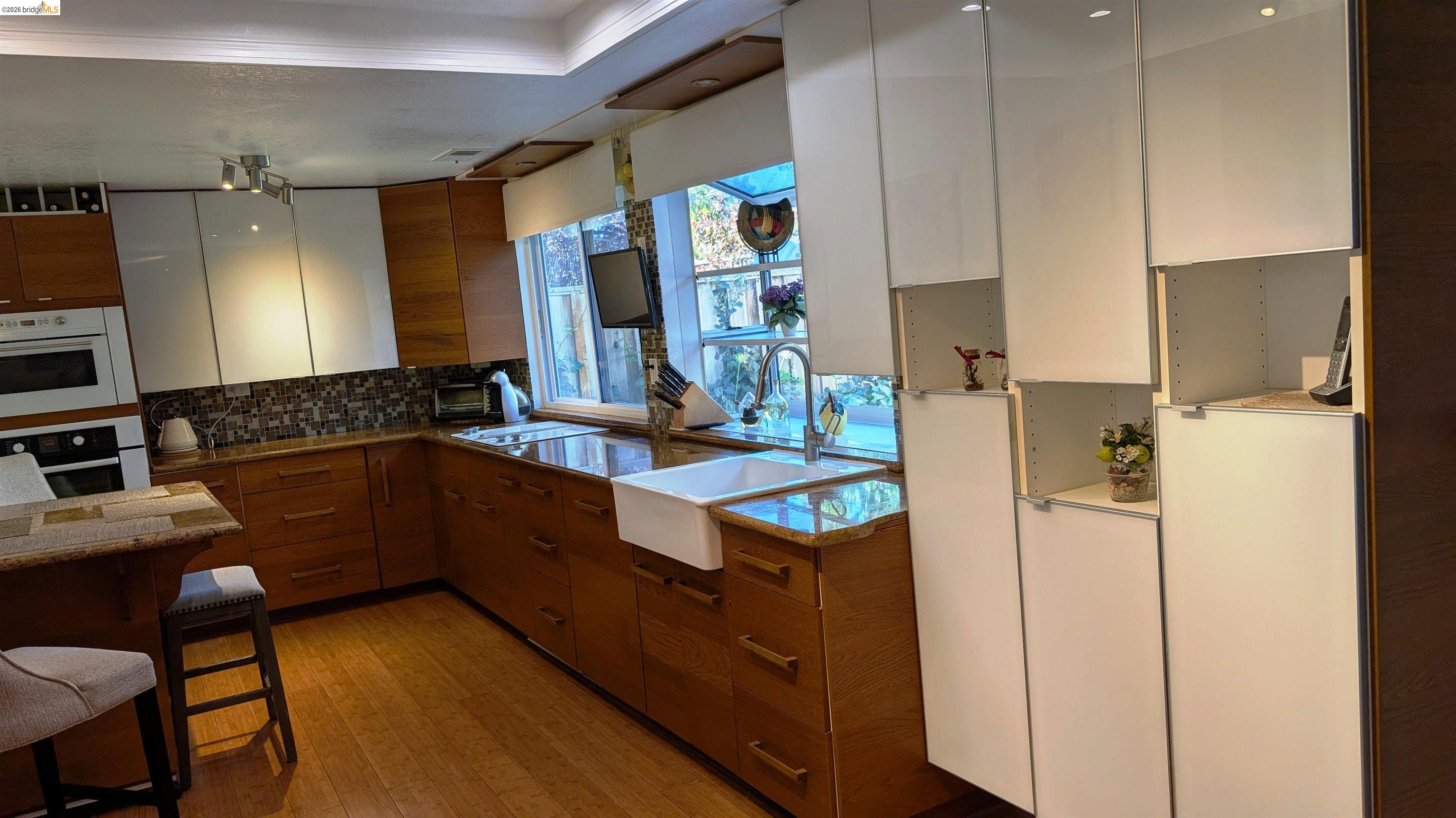 10013 Foxboro Circle San Ramon, CA 94583 - Photo 29 of 45 a kitchen with stainless steel appliances granite countertop a sink stove and refrigerator