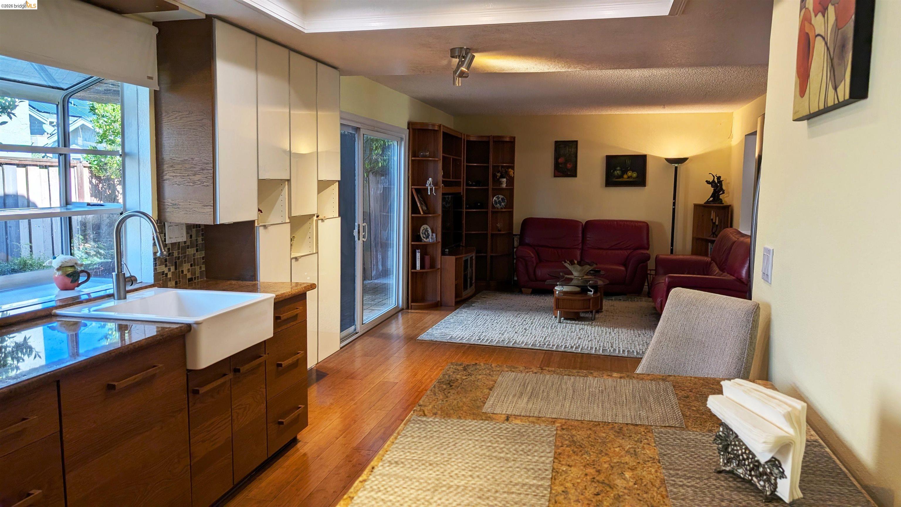 10013 Foxboro Circle San Ramon, CA 94583 - Photo 33 of 45 a large living room with stainless steel appliances furniture a window and a kitchen view