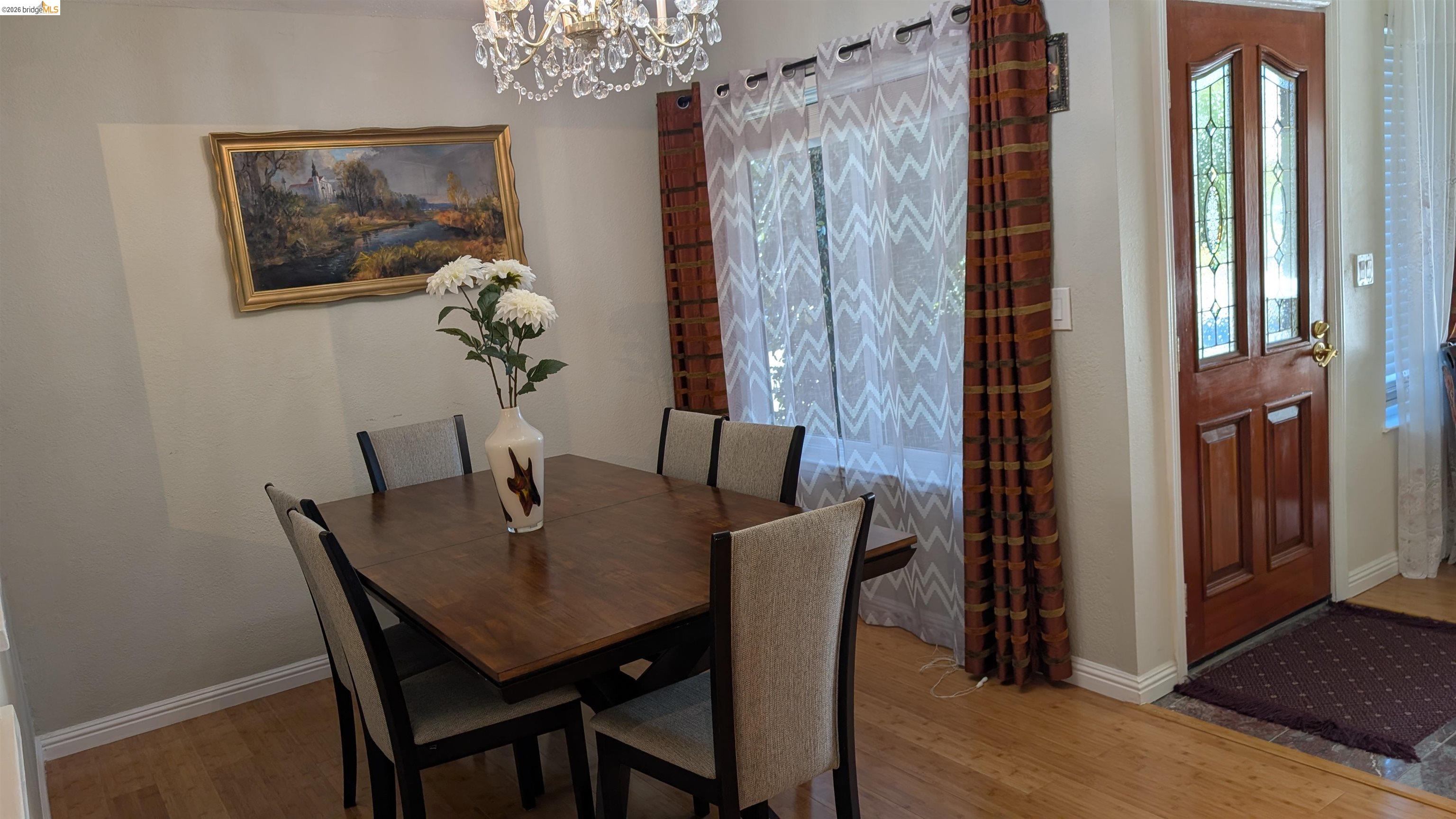 10013 Foxboro Circle San Ramon, CA 94583 - Photo 5 of 45 a view of a dining room with furniture and wooden floor