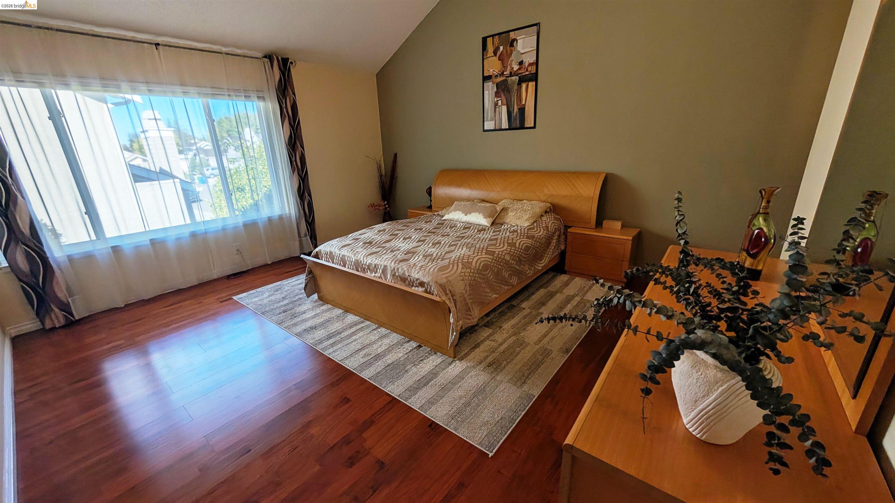 10013 Foxboro Circle San Ramon, CA 94583 - Photo 9 of 45 a bed sitting in a bedroom next to a window