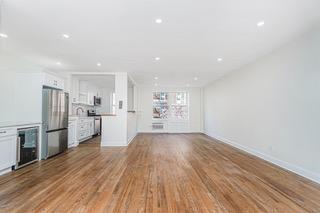 9201 Shore Road, Unit C209 Brooklyn, NY 11209 - Photo 12 of 23 a view of a kitchen with wooden floor