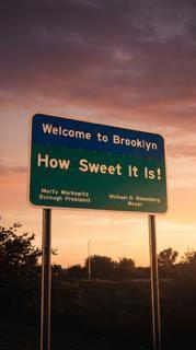 9201 Shore Road, Unit C209 Brooklyn, NY 11209 - Photo 20 of 23 a view of a sign on a city street