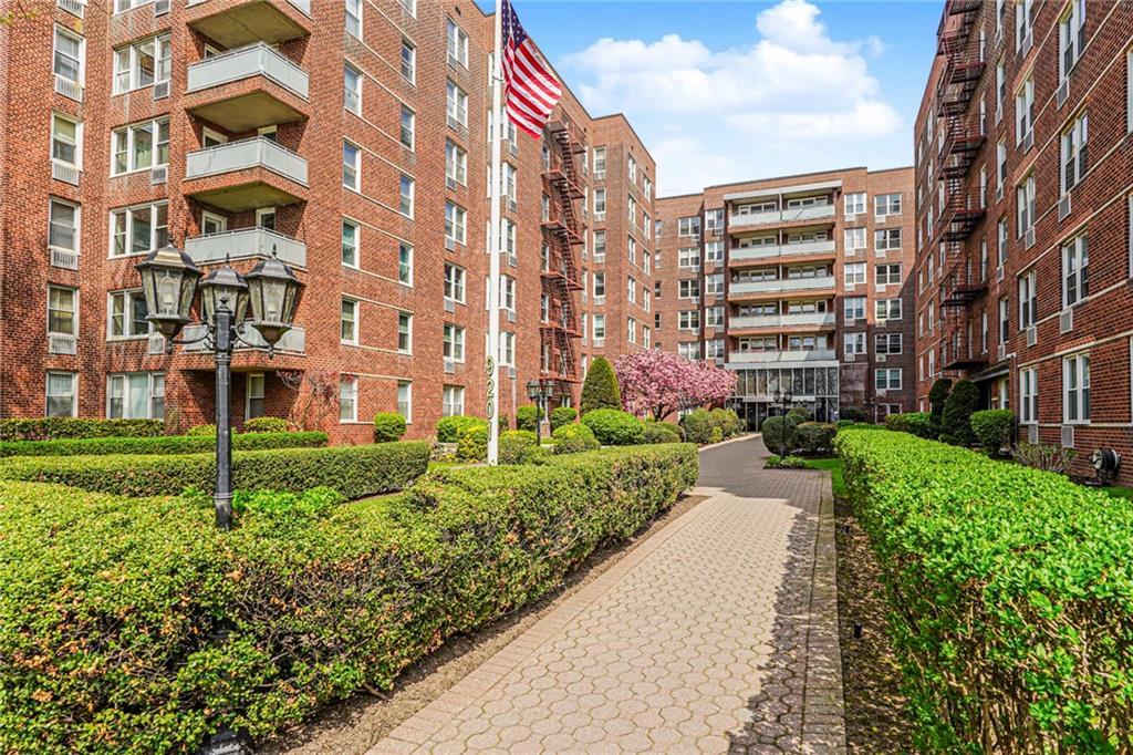 9201 Shore Road, Unit C209 Brooklyn, NY 11209 - Photo 2 of 23 a view of a building with a yard