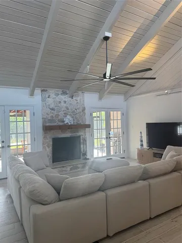 a living room with furniture windows and a fireplace