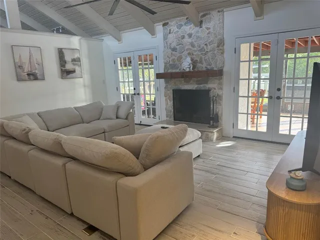a living room with furniture and a fireplace