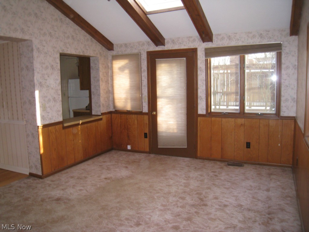 1250 Brainard Road Lyndhurst, OH 44124 - Photo 5 of 20 Family room boasts beamed ceiling, skylights, and door to the patio.