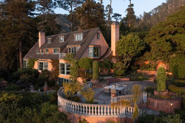 a front view of house with yard and green space