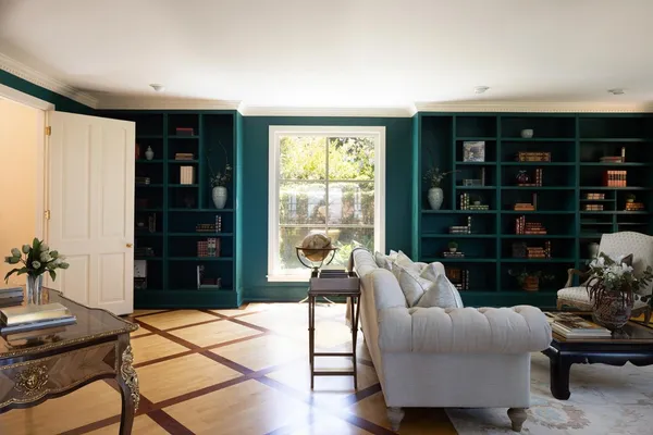 a kitchen with stainless steel appliances white cabinets and a refrigerator