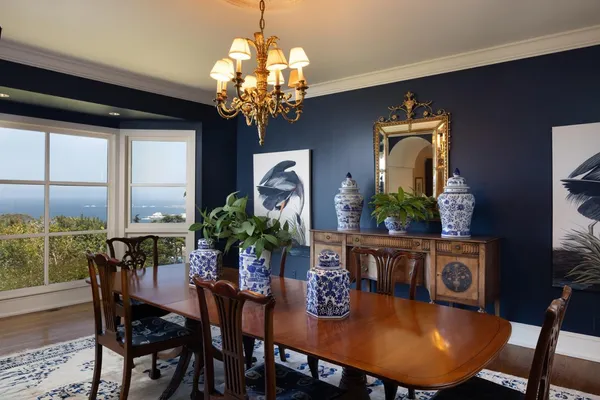 a bathroom with a granite countertop sink a mirror and shower